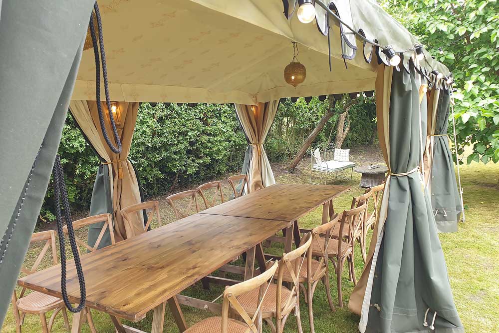 Intimate Dinner Party in a 3x6m Jasmine Lined Arabian Tent with Tables and Chairs.