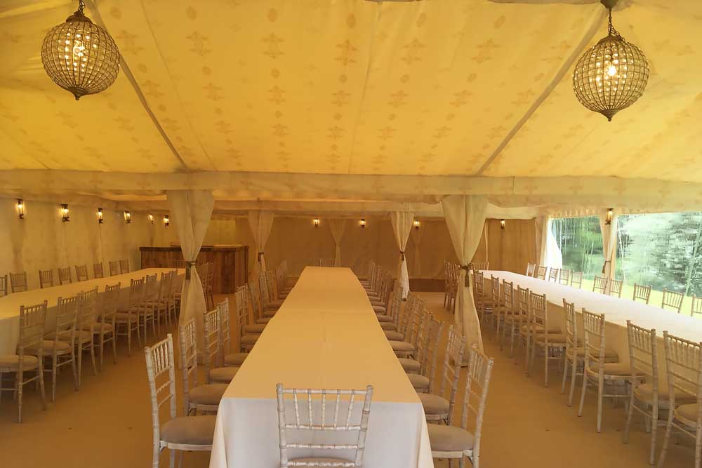 A 9x18m Wedding Marquee with Jasmine Lining, Tables and Chairs.