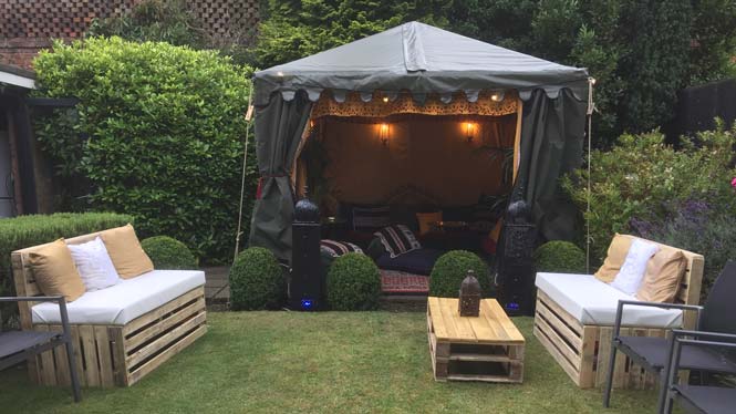 A 3mx3m Bedouin Tent with Pallet Benches Outside