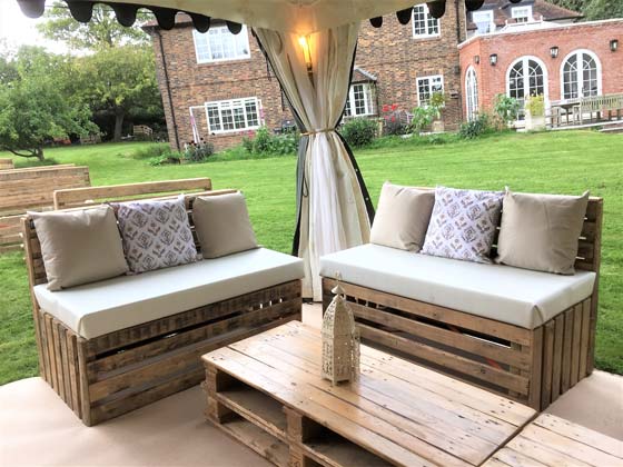 Two Pallet Benches with Attractive Cushions Inside an Arabian Tent