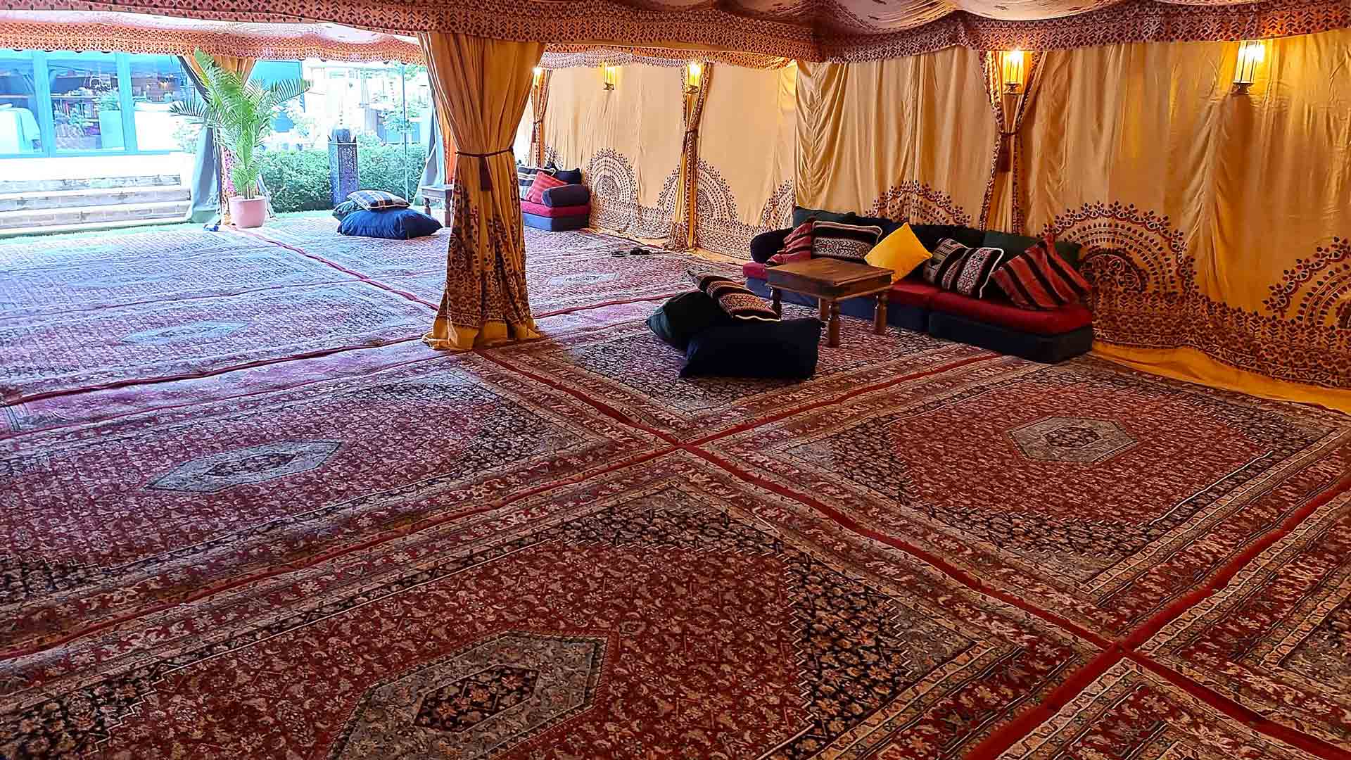 Hired Persian Rugs Joined Together to Make a Large Arabian Carpet Inside a Bedouin Tent